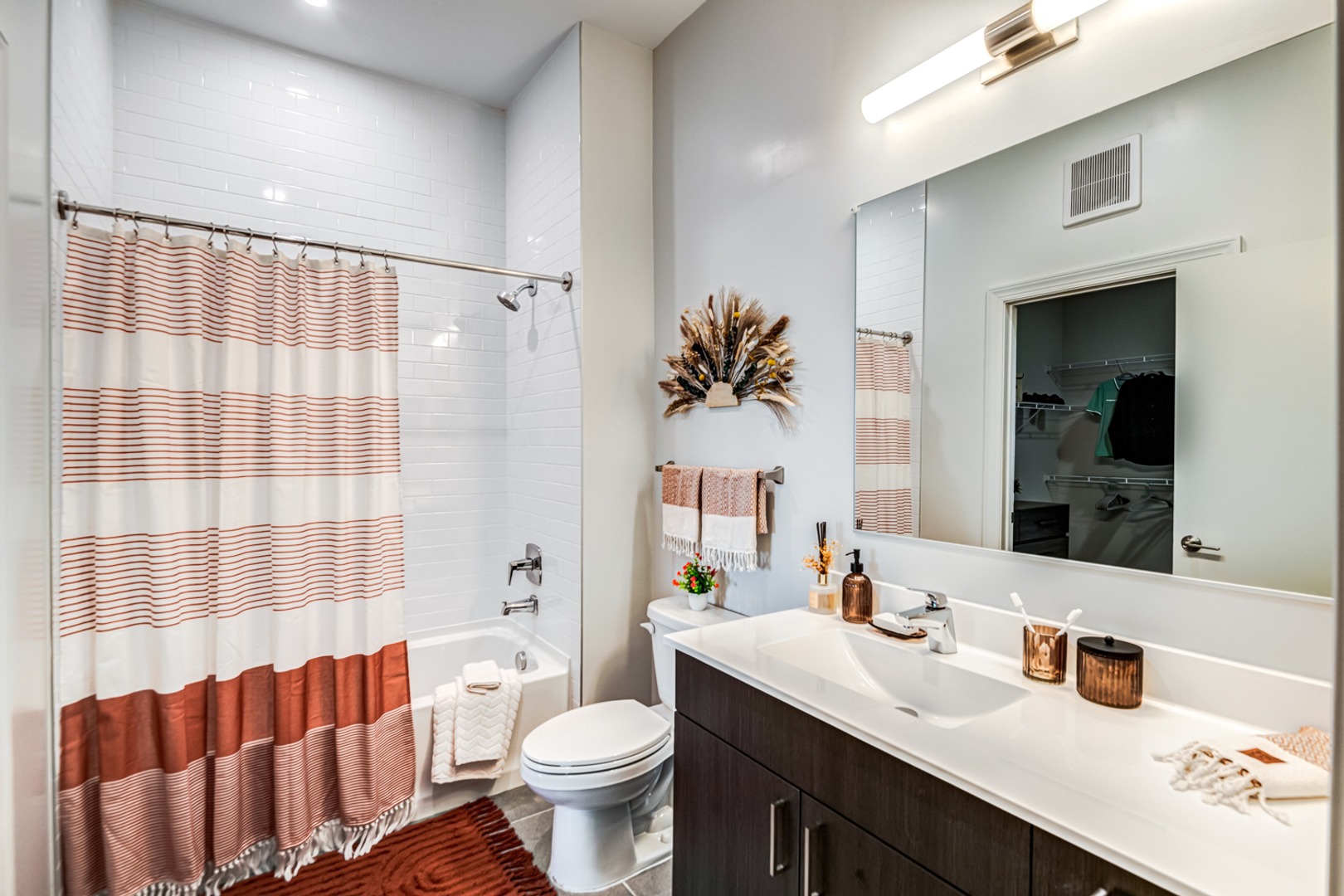Bathroom with bathtub and large vanity